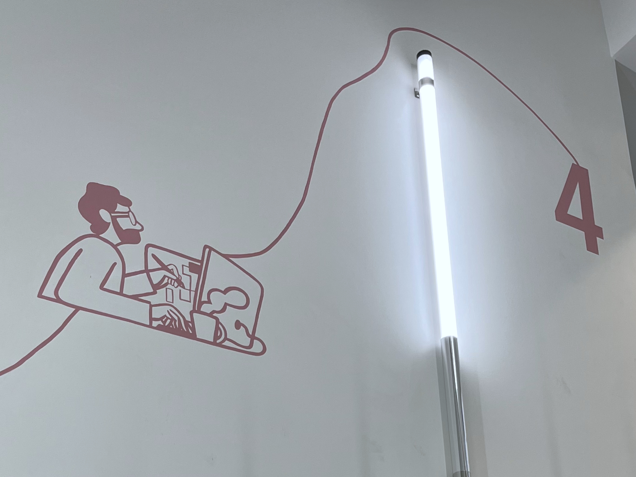 Fresque murale peinte pour l’entreprise MALT à Paris, représentant des illustrations minimalistes sur le thème du travail collaboratif.